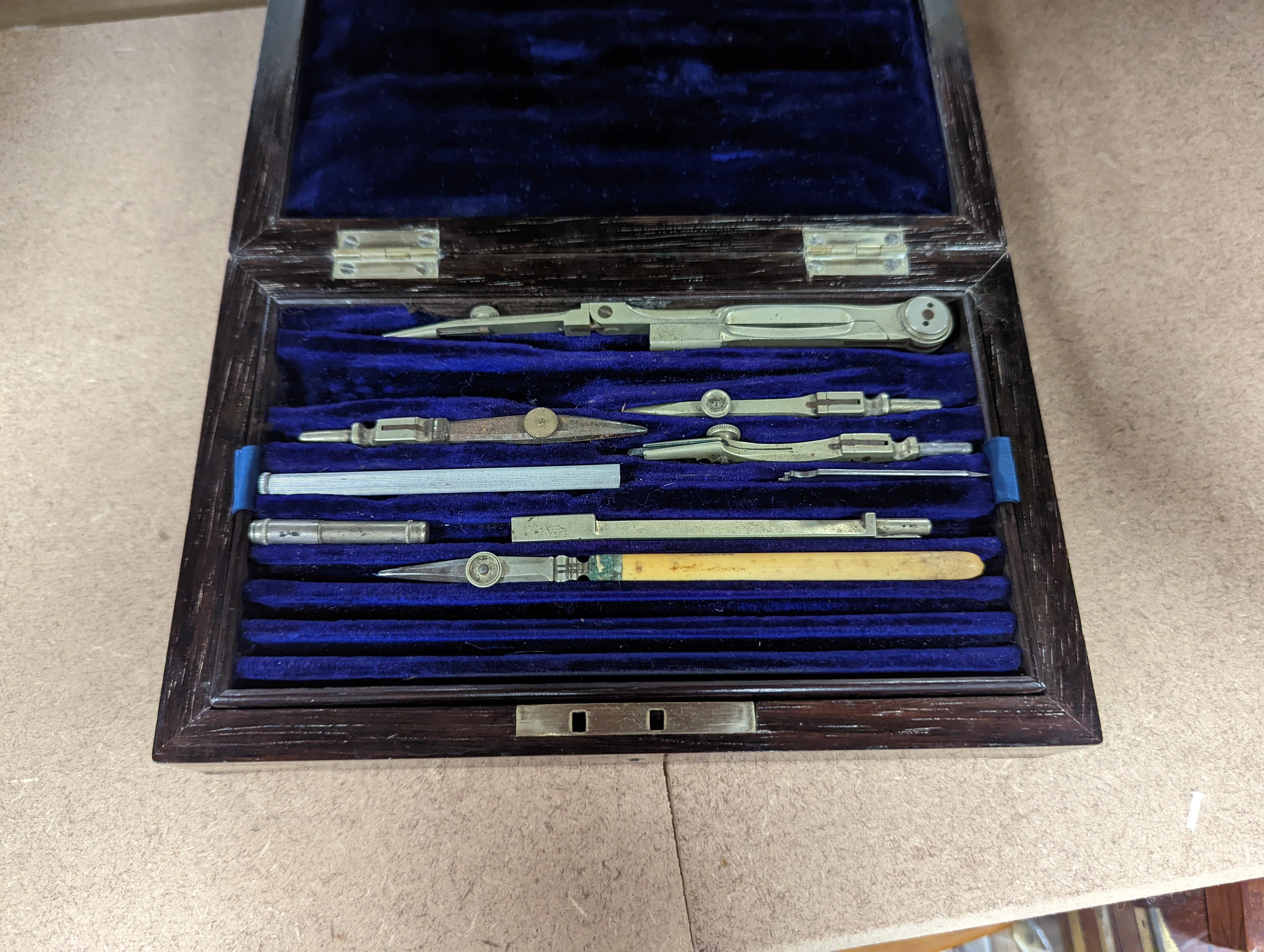 A collection of mahogany cased drawing instruments (8)